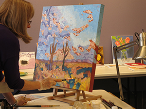 Artist painting in studio