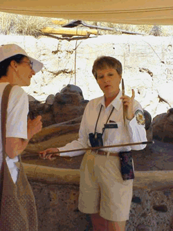 Docent interpreting dinosaur bones