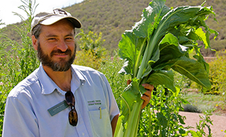 Educator Jesus with native plant